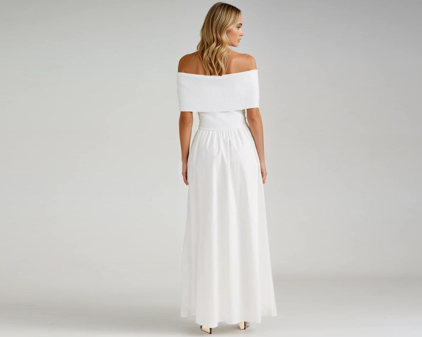 The dress features a wide, folded neckline that gracefully drapes over the shoulders, highlighting the collarbone for a sophisticated and feminine look. The fitted bodice transitions into a flowing A-line skirt, creating a flattering silhouette that moves beautifully with every step. Thoughtfully designed with discreet side pockets, this dress blends style and practicality. Crafted from lightweight, breathable fabric, it offers all-day comfort, making it perfect for warm-weather occasion.
